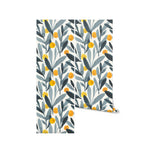 A roll of Designer Floral Wallpaper displayed, illustrating a sophisticated pattern of gray leaves interspersed with yellow berries, perfect for adding a touch of elegance and color to any room