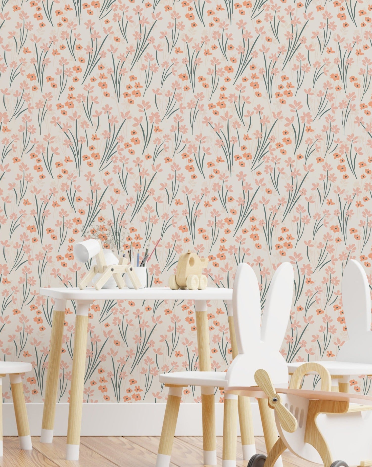 A vibrant and cheerful children's playroom features walls covered with the orange and pink floral wallpaper. The space is furnished with a white table, whimsical animal-shaped chairs, and wooden toys, creating a playful and inviting atmosphere.