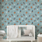 Nursery room with 'Hello Sky Dream' wallpaper, light blue balloons, a white crib, and a cozy blanket creating an imaginative space theme