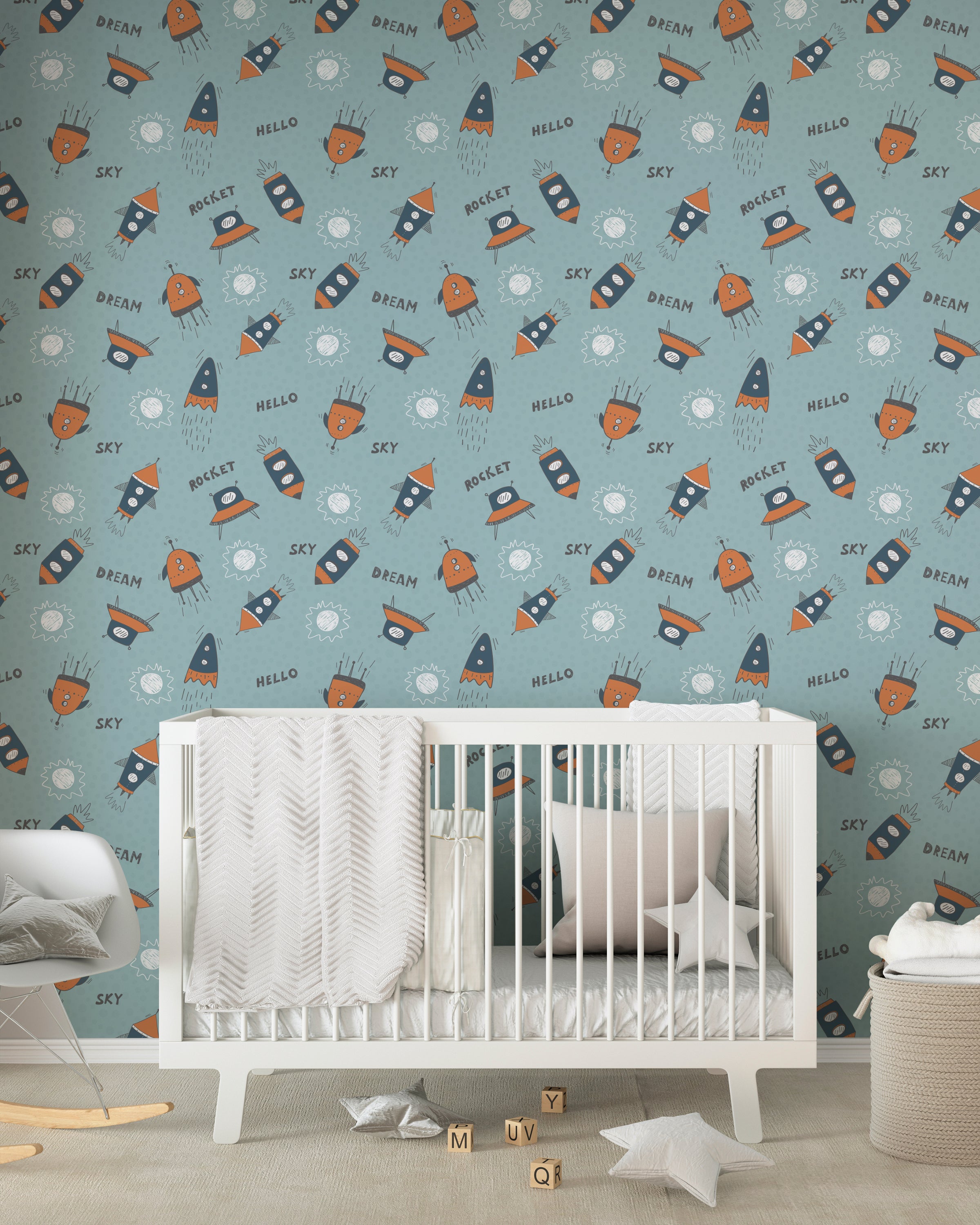 Nursery room with 'Hello Sky Dream' wallpaper, light blue balloons, a white crib, and a cozy blanket creating an imaginative space theme