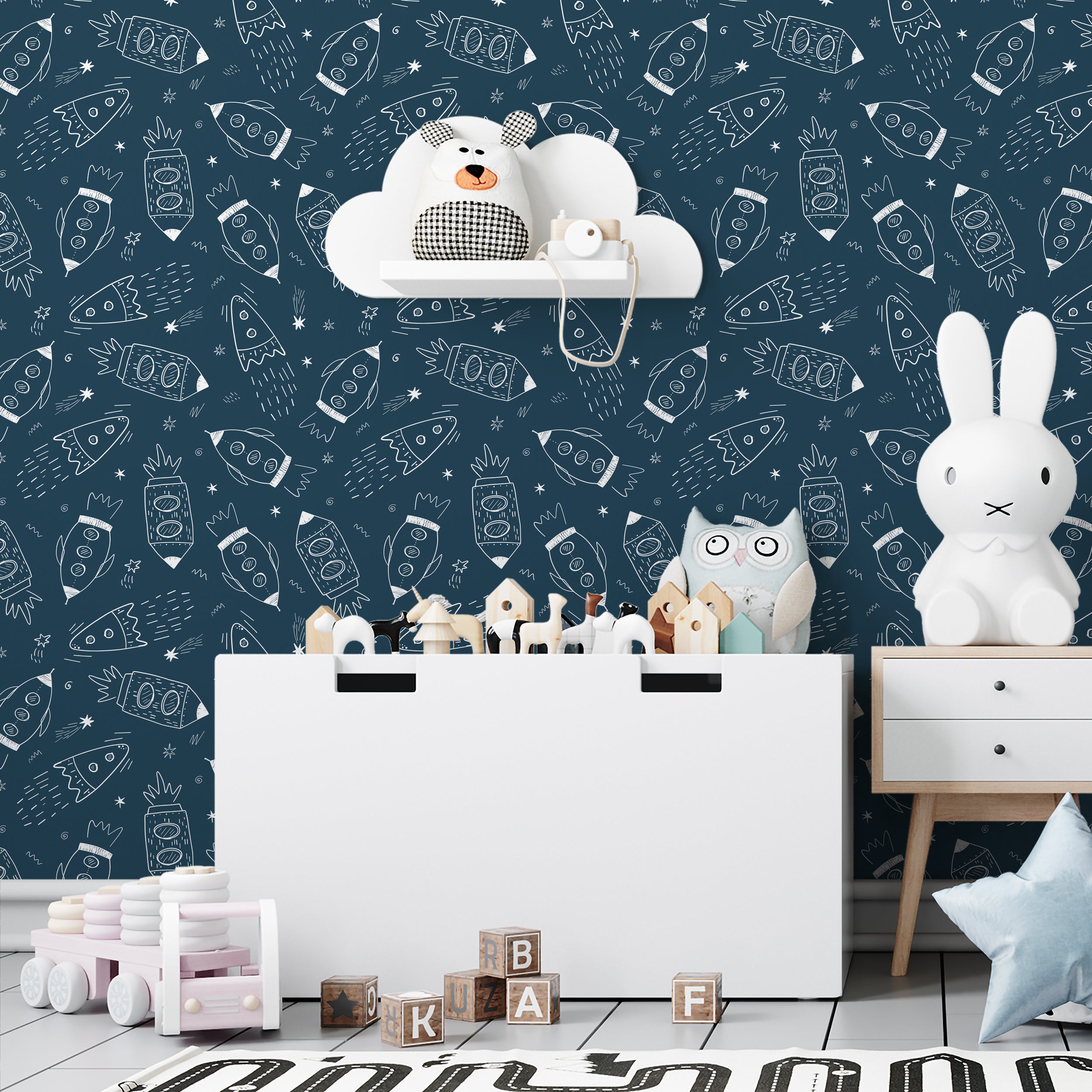 Children's room showcasing 'Cosmic Doodles' wallpaper with toy-stuffed cloud shelves and a playful mix of decor, evoking a fun space theme.