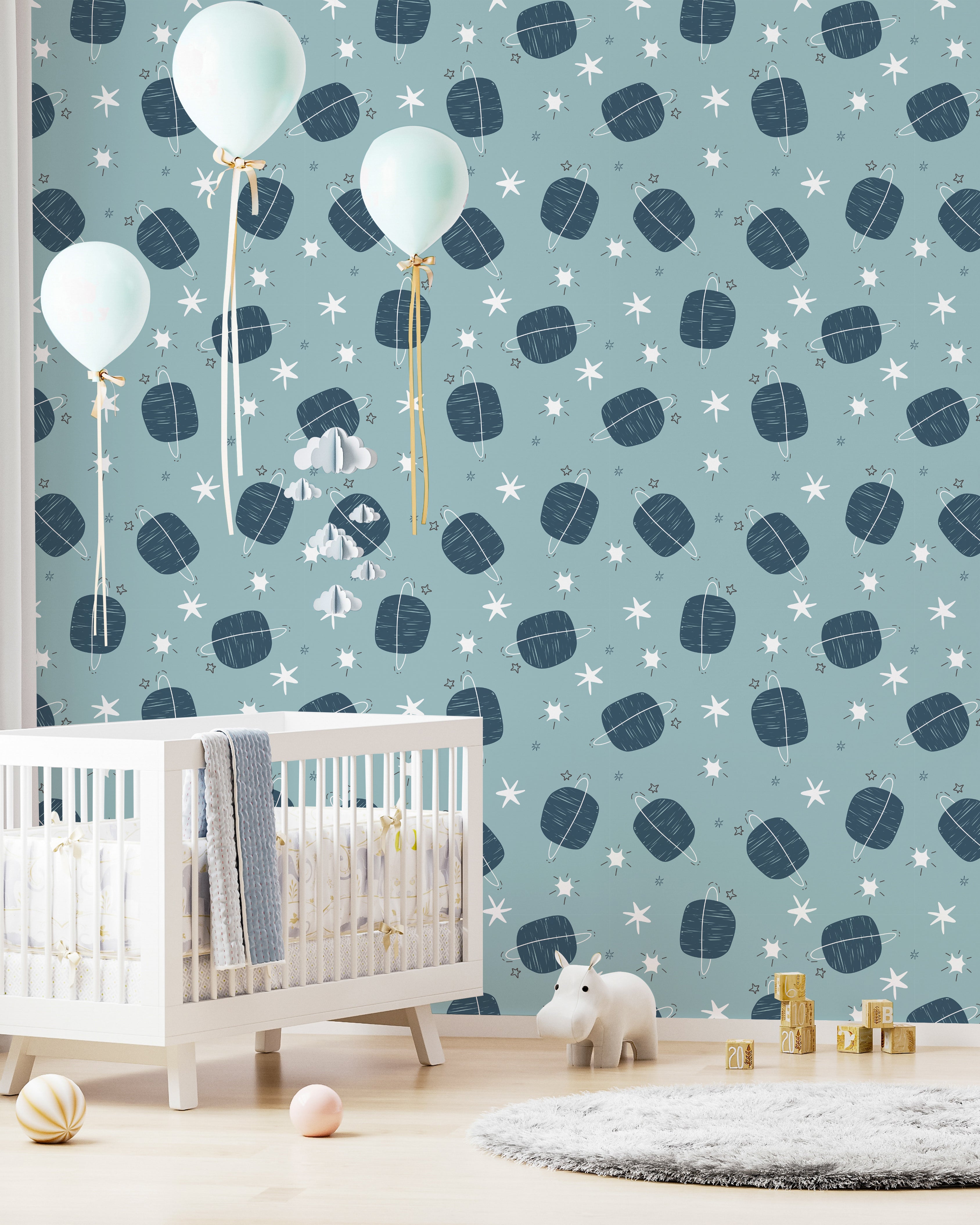 "Bright nursery featuring 'Starlit Planets' wallpaper, white furniture, light blue balloons, and a gentle, starry theme."