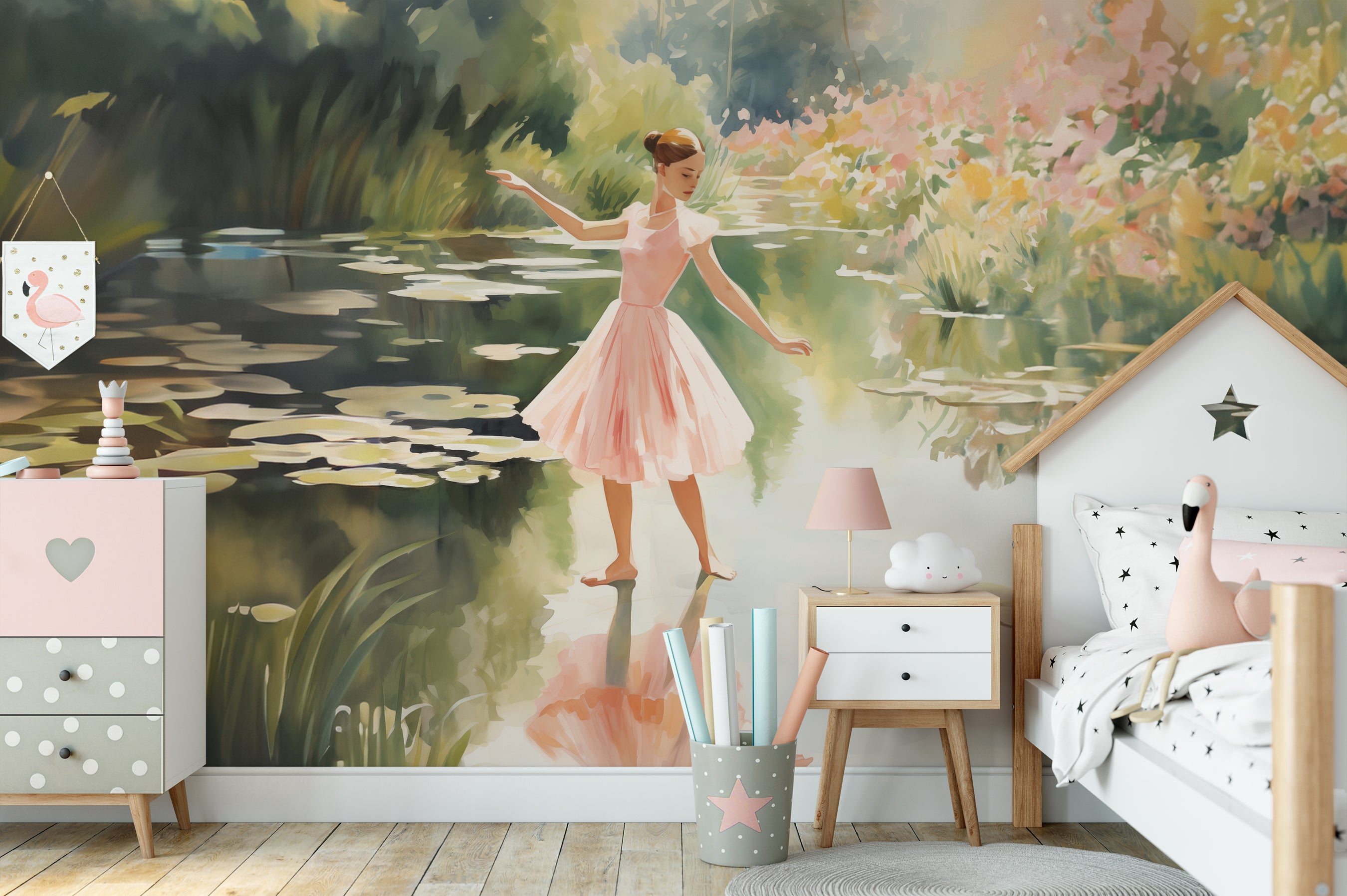 A children's room featuring a large mural of a ballerina dancing by a pond, beside a white bed and a pink and white chest of drawers.