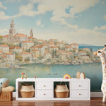 Elegant nursery featuring Dubrovnik Coast Mural with floating balloons and stylish storage baskets."