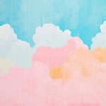 "Bright and colorful 'Candy Clouds Mural' in a child's room, showcasing fluffy clouds in shades of pink, blue, and yellow against a clear sky backdrop."