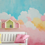"Vibrant 'Candy Clouds Mural' in a nursery, with pastel clouds painted on the wall, enhancing the cheerful and soothing environment."