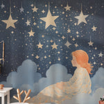 Children's playroom featuring 'Sweet Dreams Mural' with a young girl looking at a starry night sky and dreamy clouds.