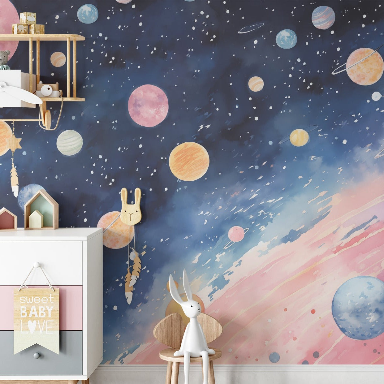 Nursery room with a vibrant Outer Space Mural, featuring planets and stars, and a playful decor setting.