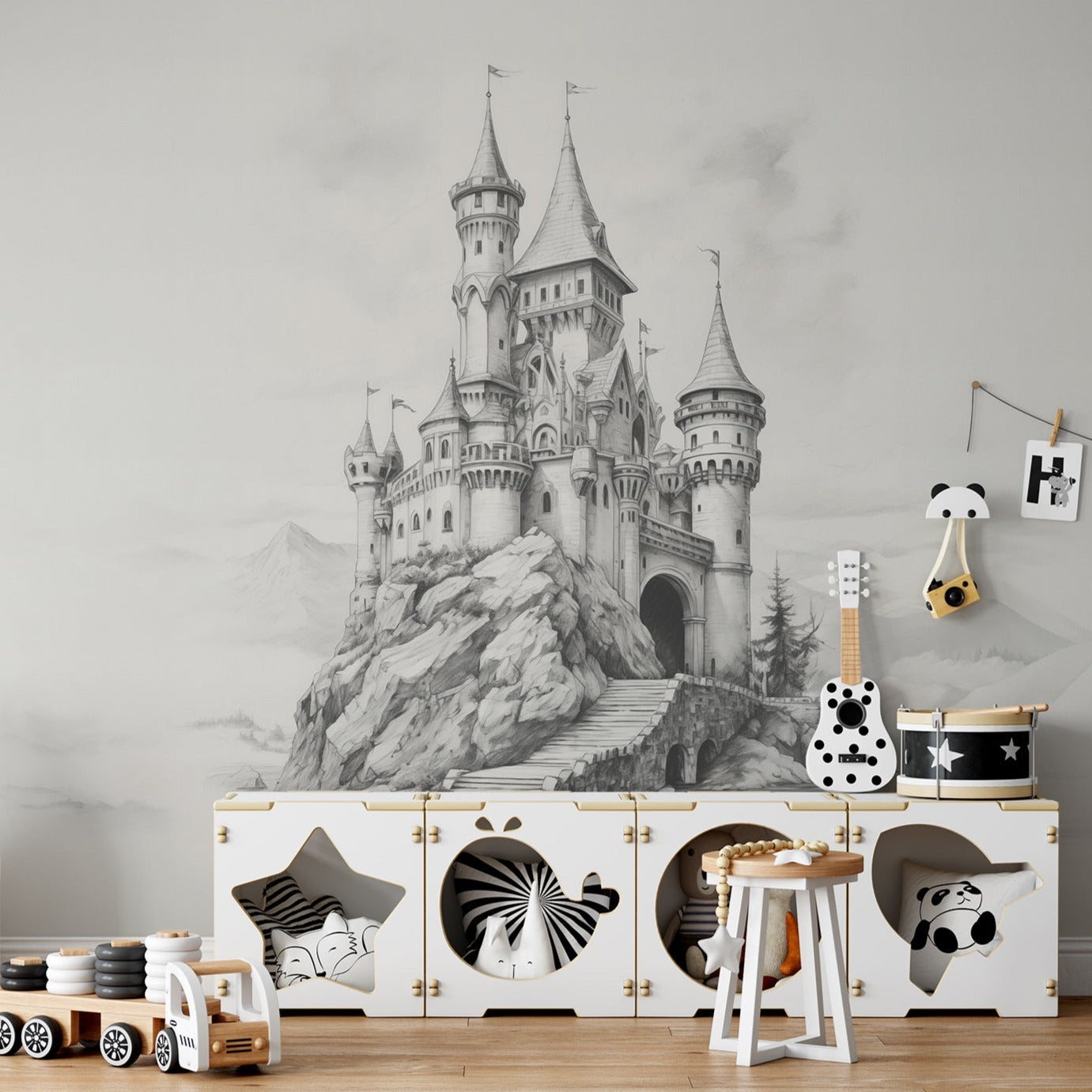 Cloud Castle wallpaper mural in a children's playroom with storage boxes, toys, and decorative items.