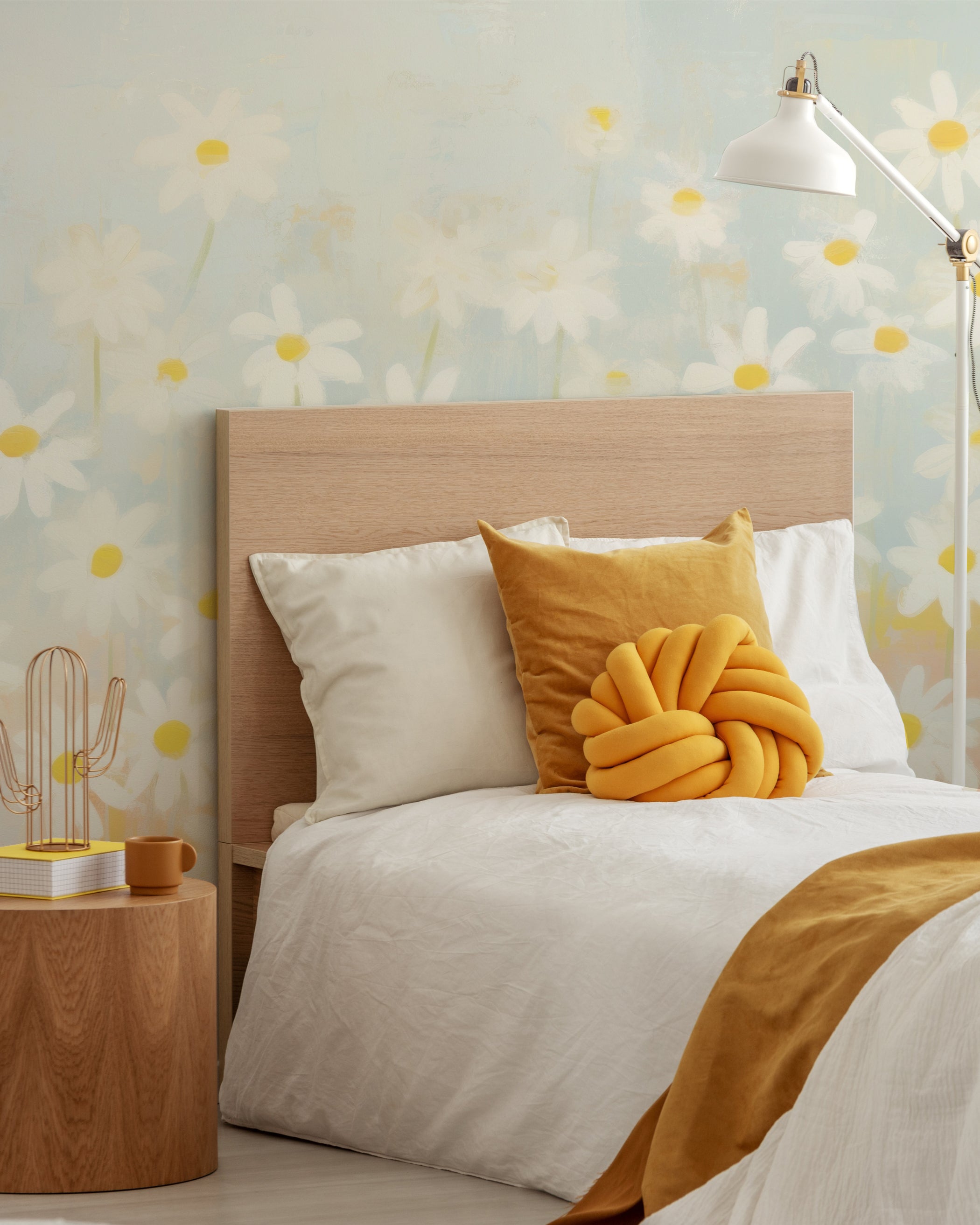Bedroom decorated with the Spring Daisy Mural, showcasing a bed with white and yellow accents