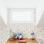 A playful children's workspace with Colourful Sea Wallpaper, featuring a vibrant pattern of various sea shells, starfish, and coral in pastel colors, providing a lively and educational backdrop