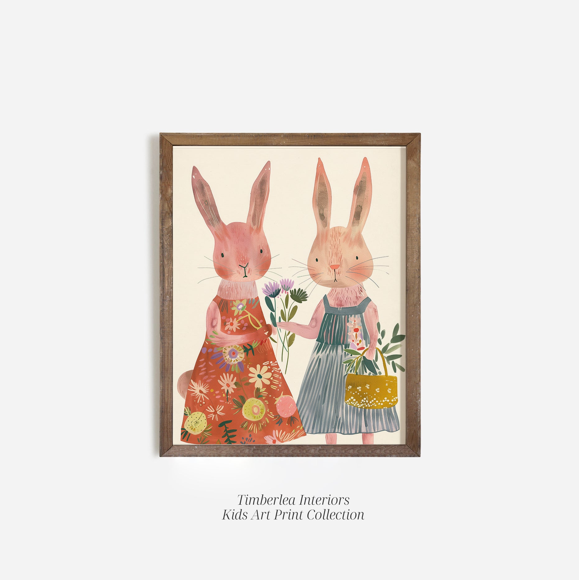 Whimsical art print of two adorable bunnies in charming outfits, holding flowers and a basket, framed in a rustic wood frame.