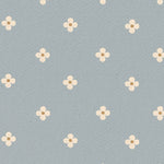 Pattern of small white flowers on a light blue background
