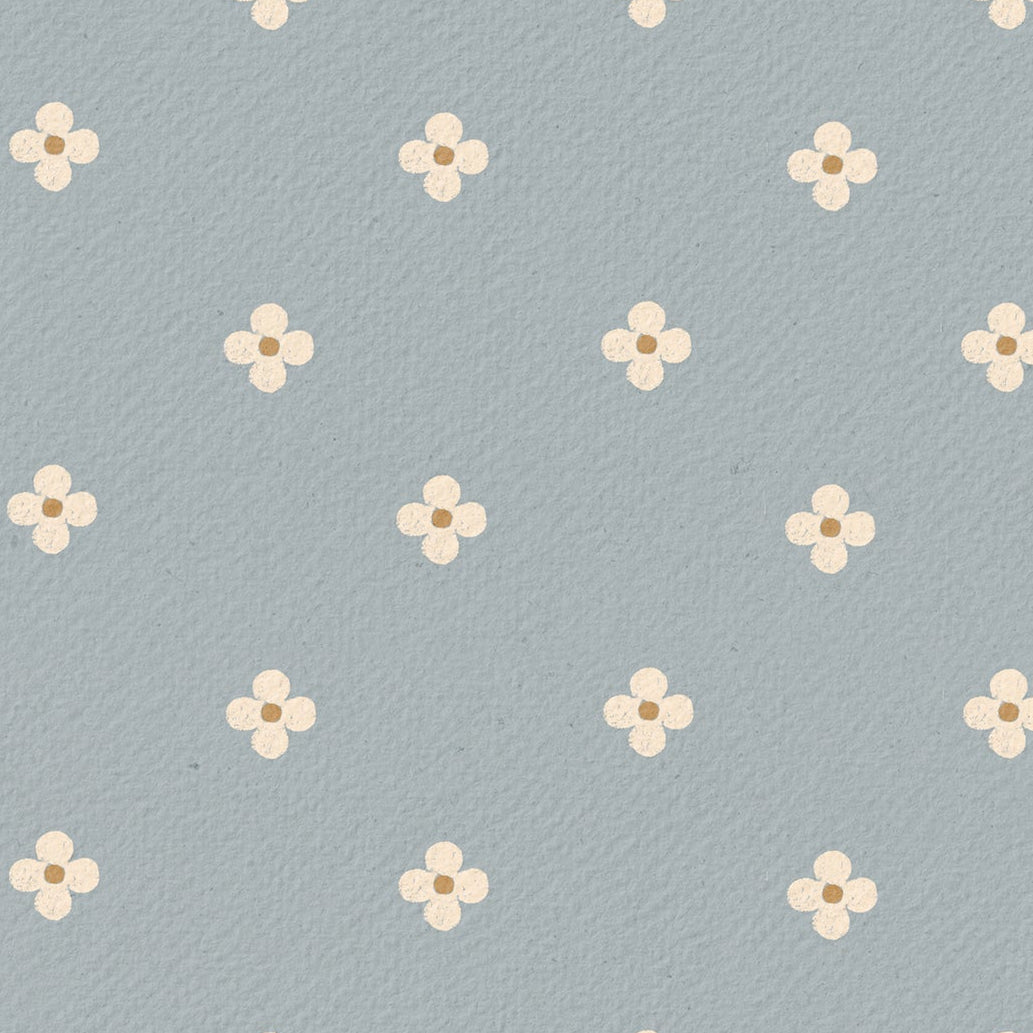 Pattern of small white flowers on a light blue background