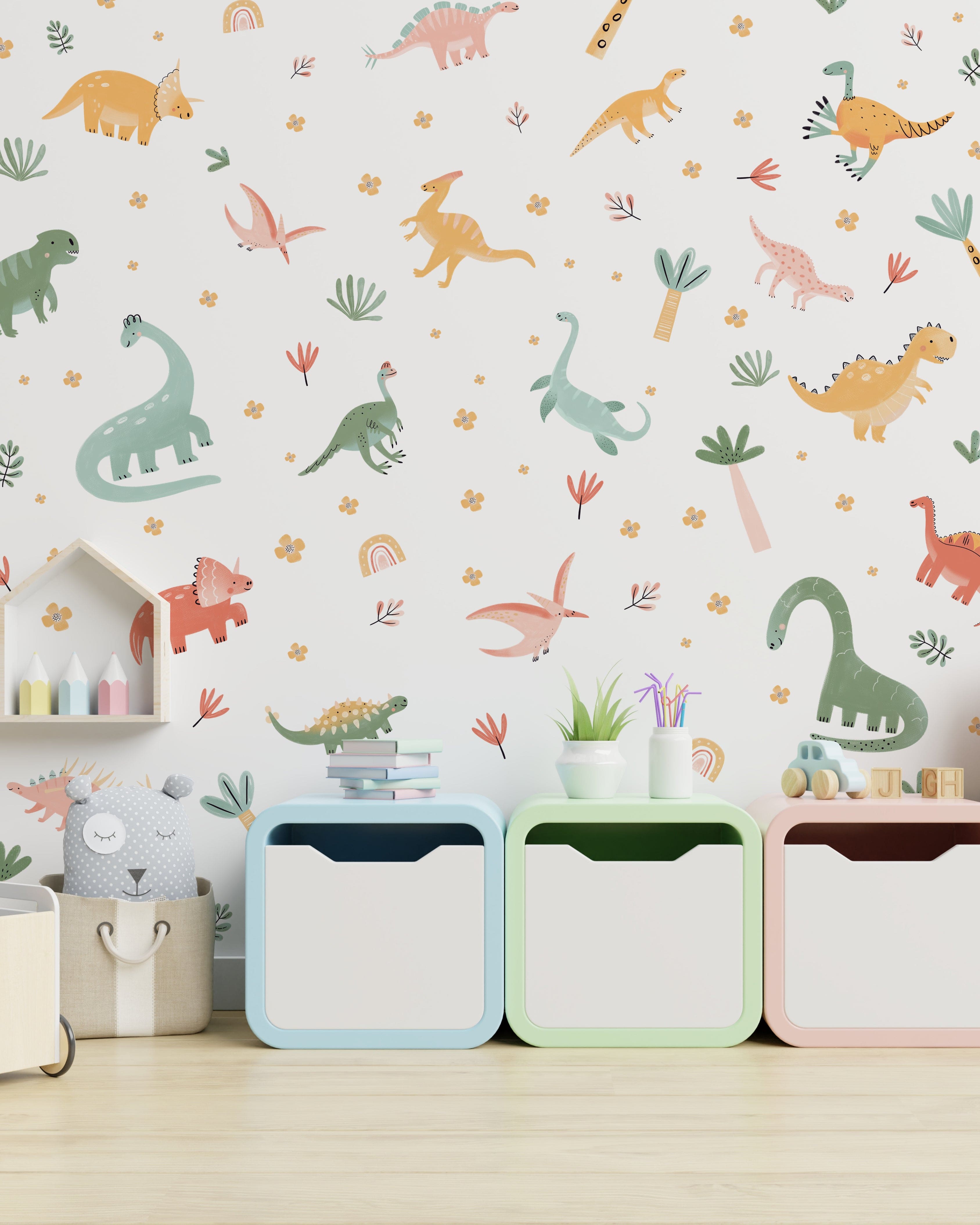 Children's room with colorful dinosaur wall decals on a white wall, featuring T-Rex, Triceratops, Stegosaurus, and Brontosaurus, with playful plants and flowers.