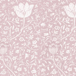 Close-up view of the Fiona Floral Wallpaper, displaying an intricate floral design in a gentle mauve shade set against a pastel pink background. The pattern includes various botanical elements, offering a delicate and romantic aesthetic