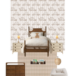 A cozy children's bedroom with a vintage wooden bed, a teddy bear, bedside tables, and lamps. The wall behind the bed is covered with Antique Auto Wallpaper, featuring a repeating pattern of old-fashioned cars on a beige striped background.
