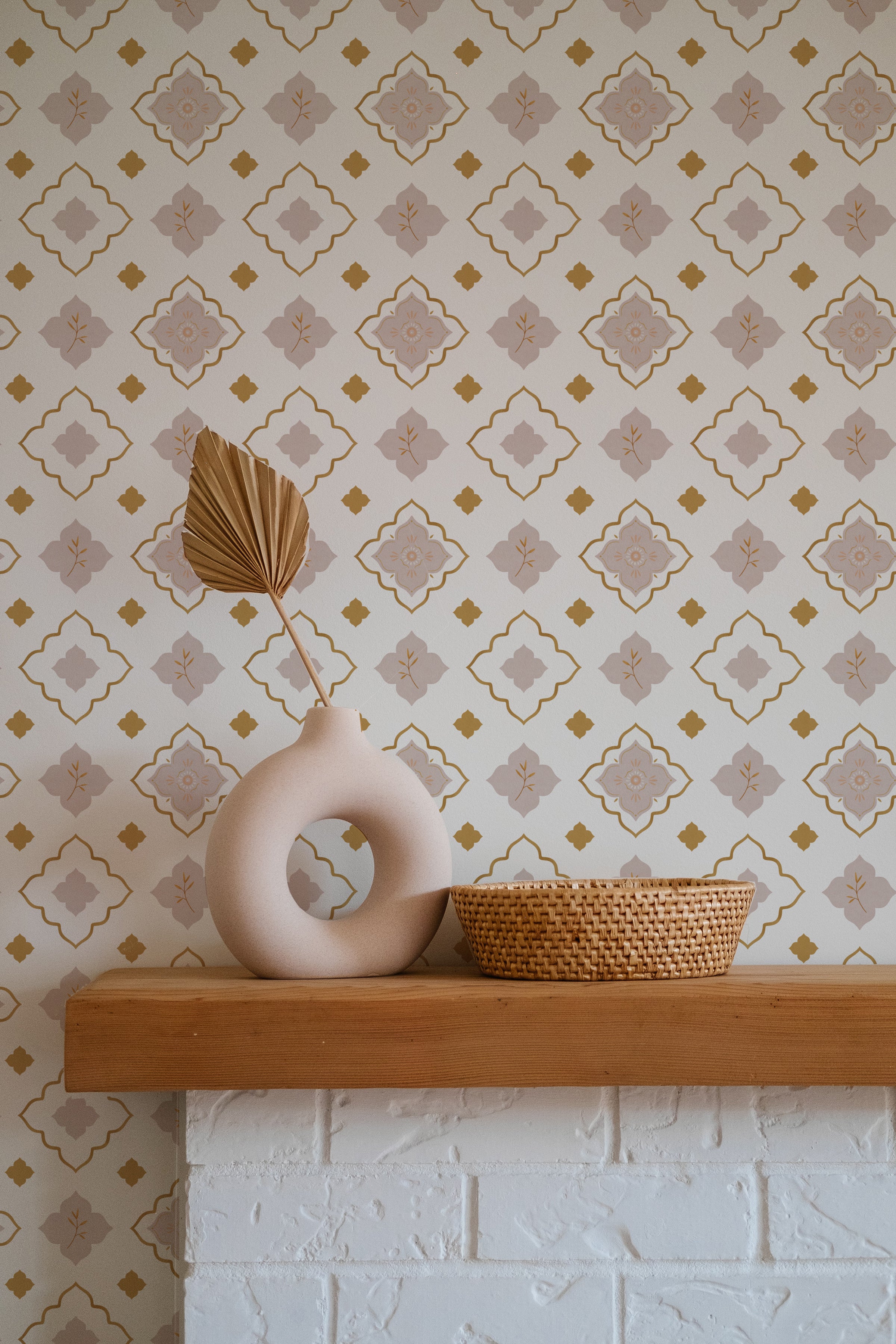 Decorative setting with Moroccan Mosaic Wallpaper in a living space, showing a wooden shelf with a ceramic vase and a woven basket against a patterned wall.