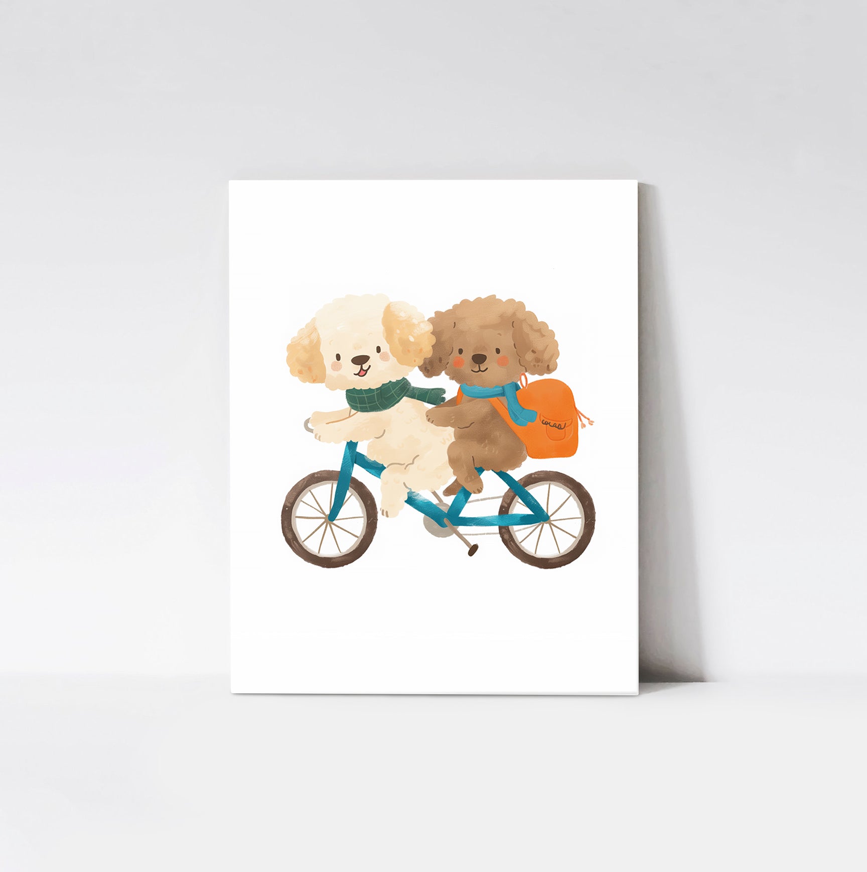 Puppy Pals Bicycle Ride Art Print from Timberlea Interiors Kids Art Print Collection mounted on a wood board, featuring two cute puppies riding a tandem bicycle with vibrant details.