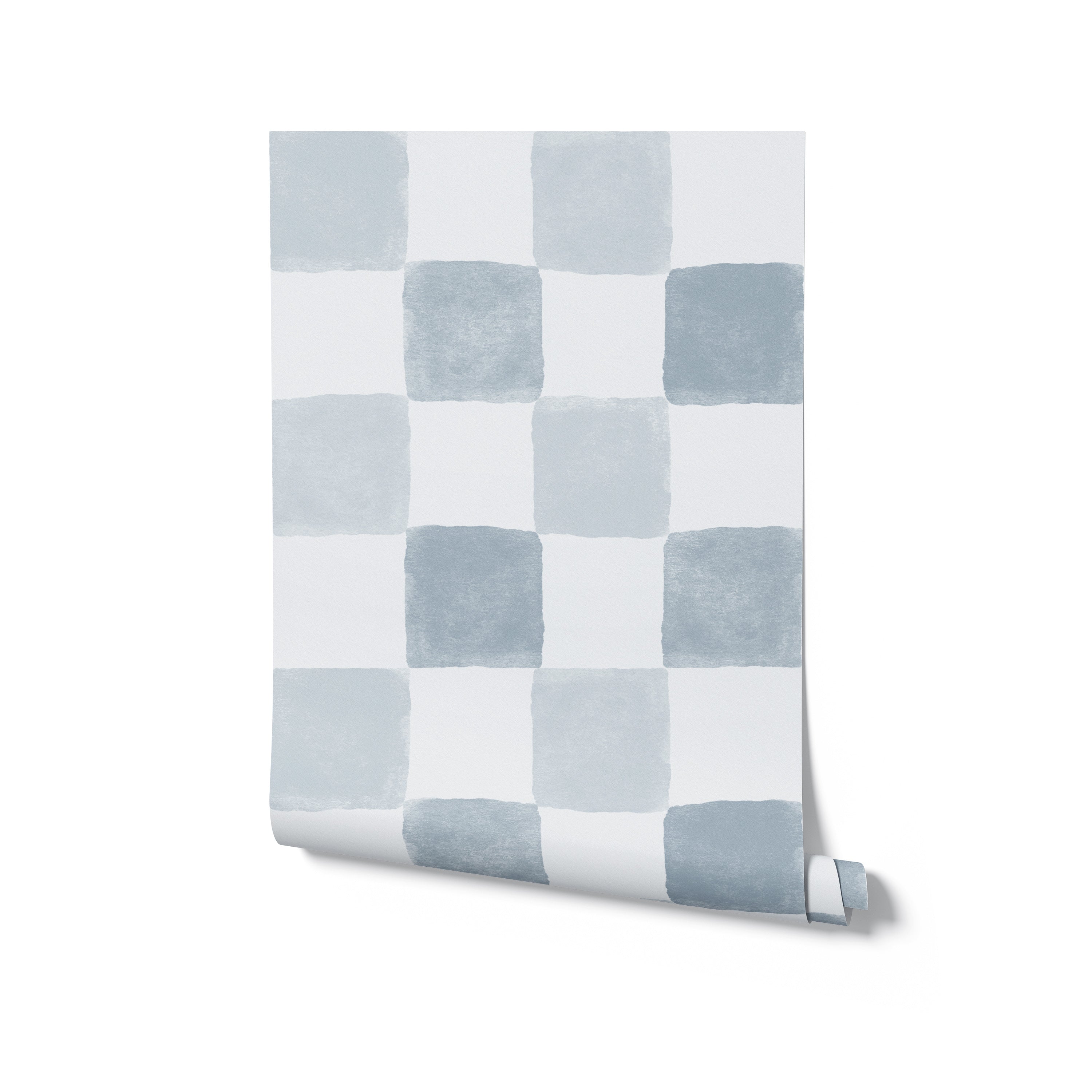 A roll of Clémence Wallpaper in Pale Blue partially unrolled to show the gentle checkered pattern of alternating pale blue and white squares, ideal for a subtle yet stylish wall accent in contemporary interiors