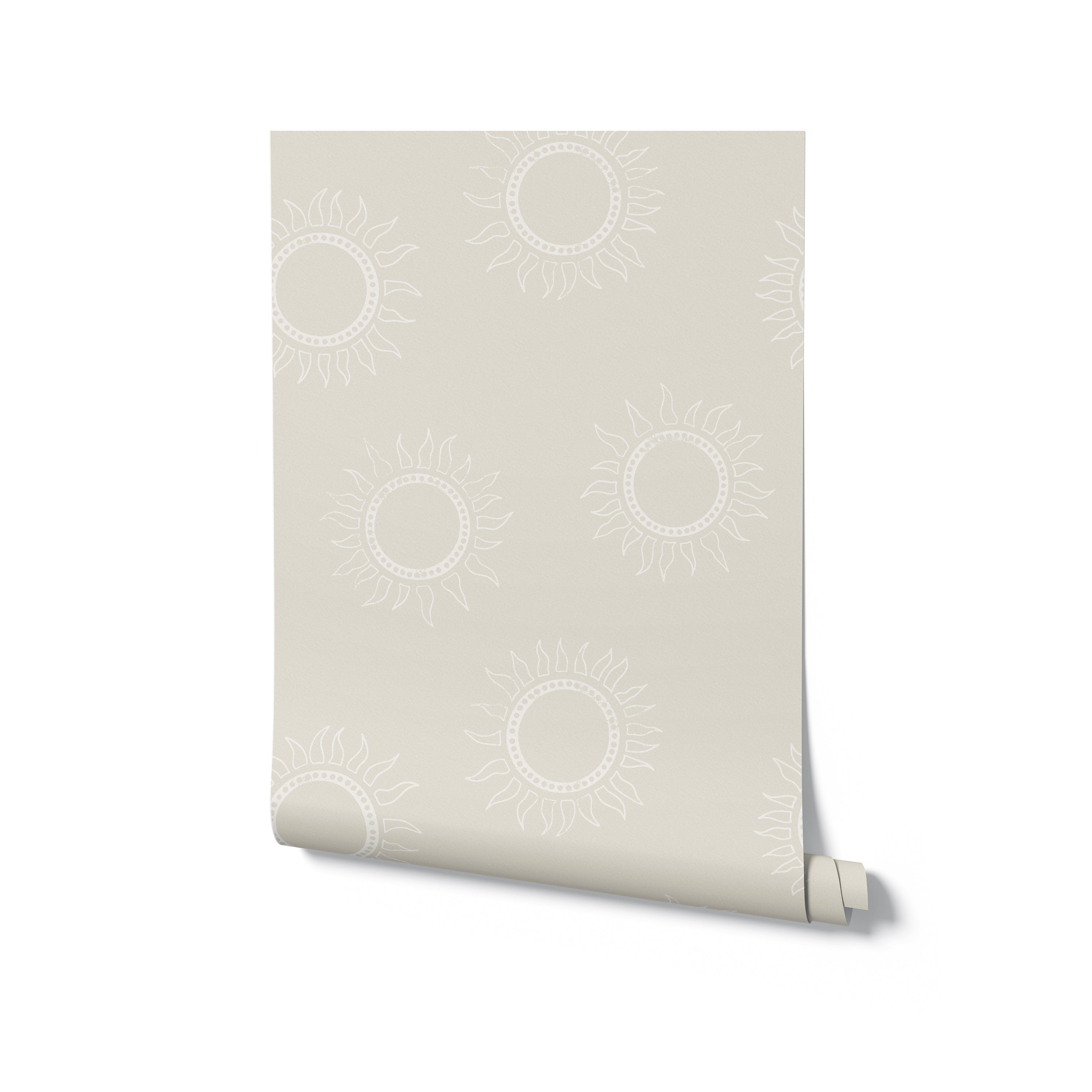 A flat lay view of a single roll of Sunburst Harmony Wallpaper. The roll showcases the detailed sunburst pattern in white on a warm beige background, emphasizing the contemporary and stylish design of the wallpaper.