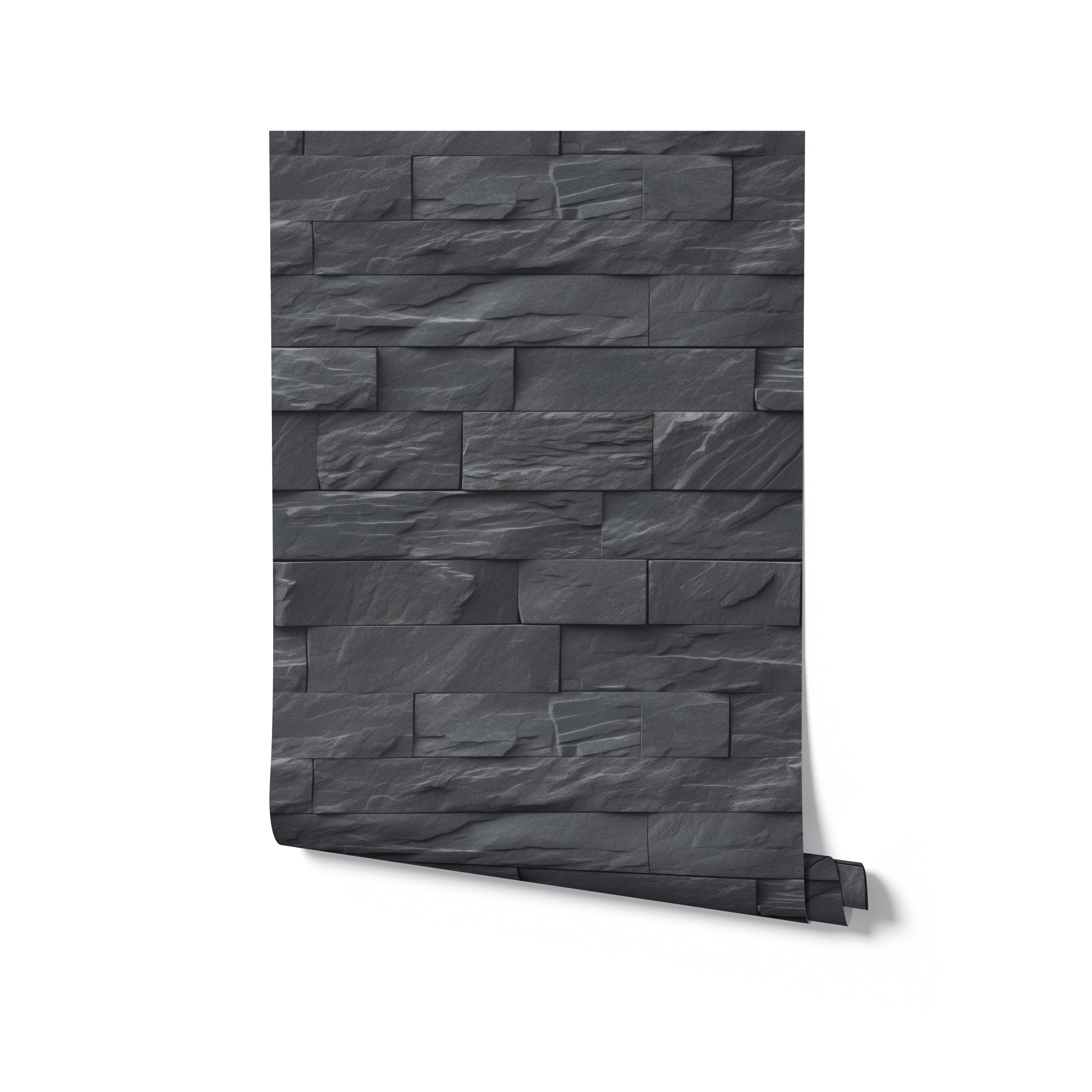 A roll of Black Brick Wallpaper with a textured, stacked stone design in dark gray. The wallpaper roll is partially unrolled, revealing its intricate and realistic stone pattern, perfect for adding a modern touch to any room.