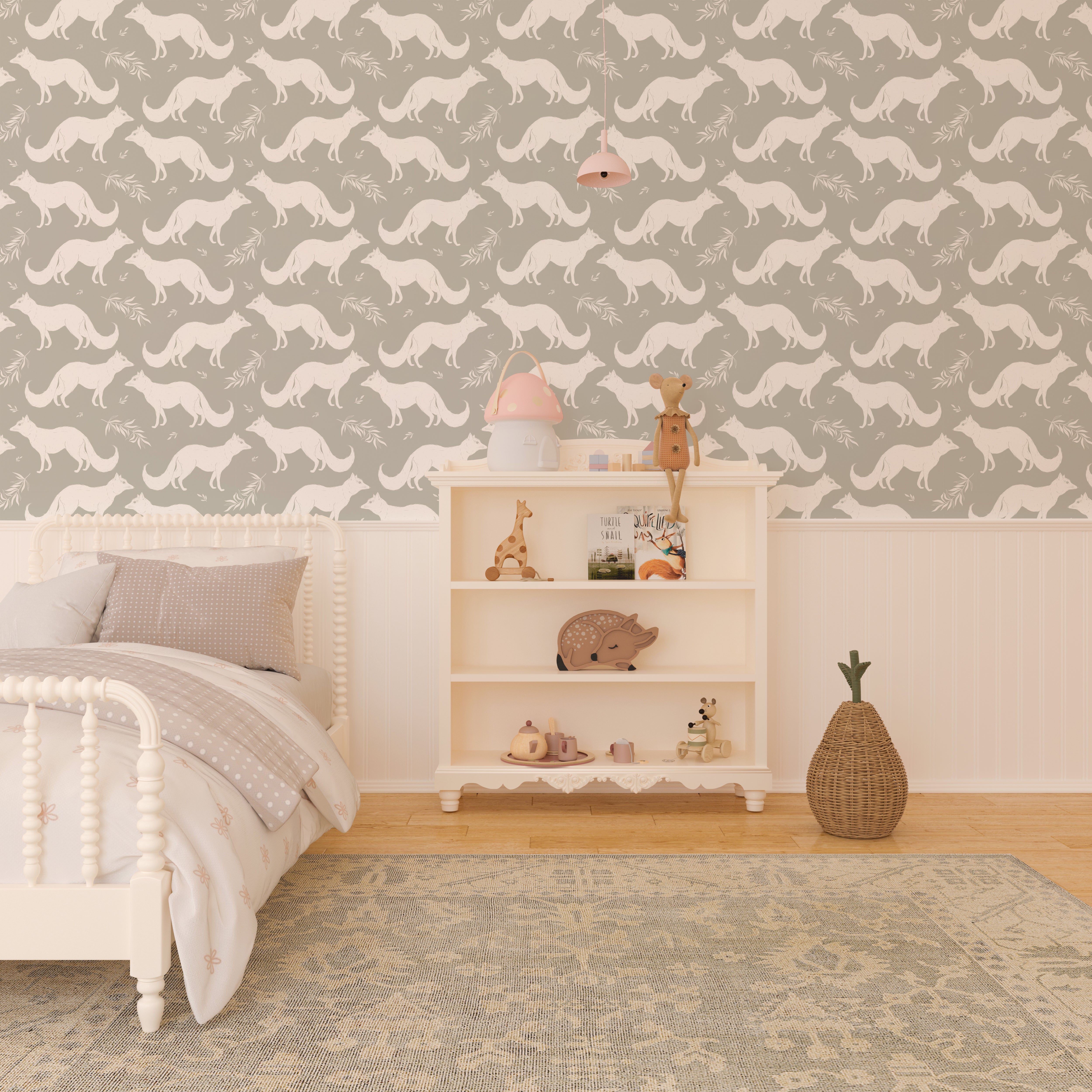 A children's room with a bed and a shelf full of toys against a muted green wallpaper featuring white foxes and delicate foliage patterns, creating a whimsical and peaceful atmosphere