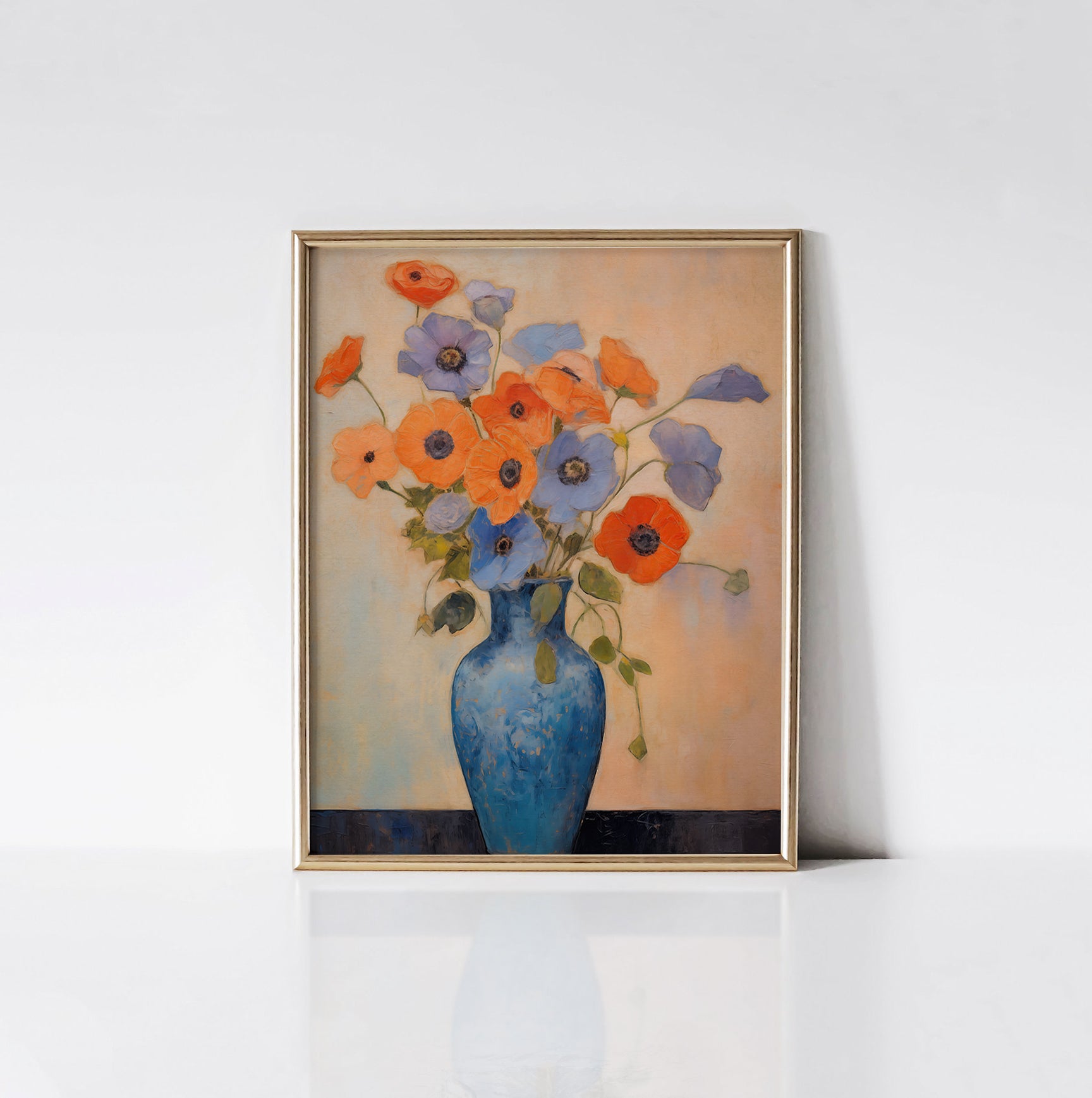 Blue Vase Blooms Art Print displayed in a gold frame against a white wall, highlighting the vivid colors and detailed brush strokes of the floral arrangement in the blue vase.