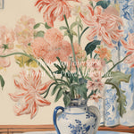 Close-up view of Mabel's Vase Floral Art Print, showcasing a beautiful arrangement of pink flowers in a blue and white vase against a soft, pastel-colored background.