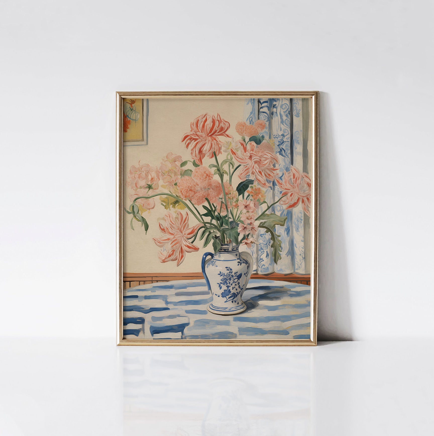 Mabel's Vase Floral Art Print displayed in a gold frame against a white wall, highlighting the vibrant pink flowers and intricate details of the blue and white vase