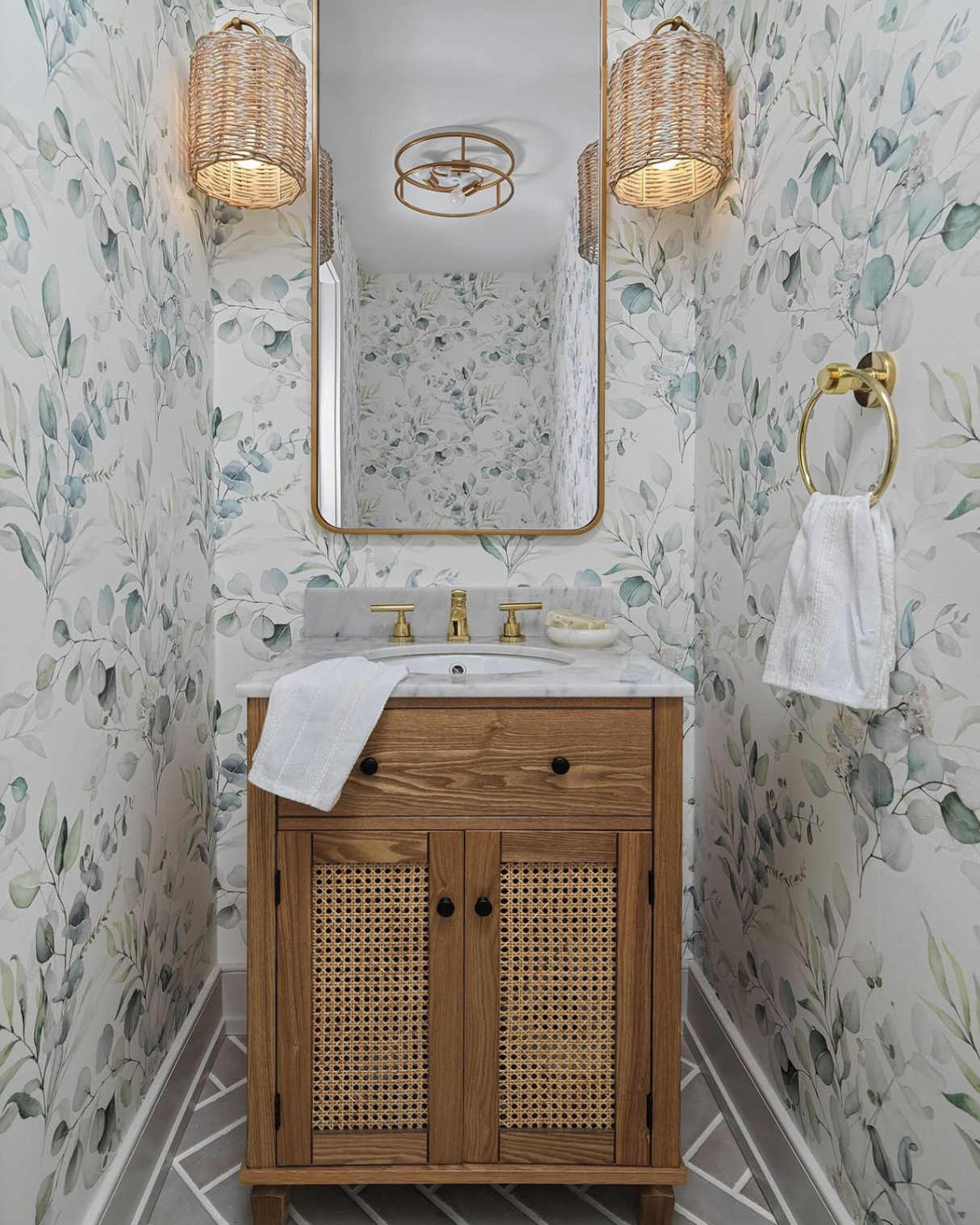 Luxurious bathroom accented with Green Leaves and Branches Wallpaper, wooden vanity, and warm lighting, offering an organic, spa-like retreat.