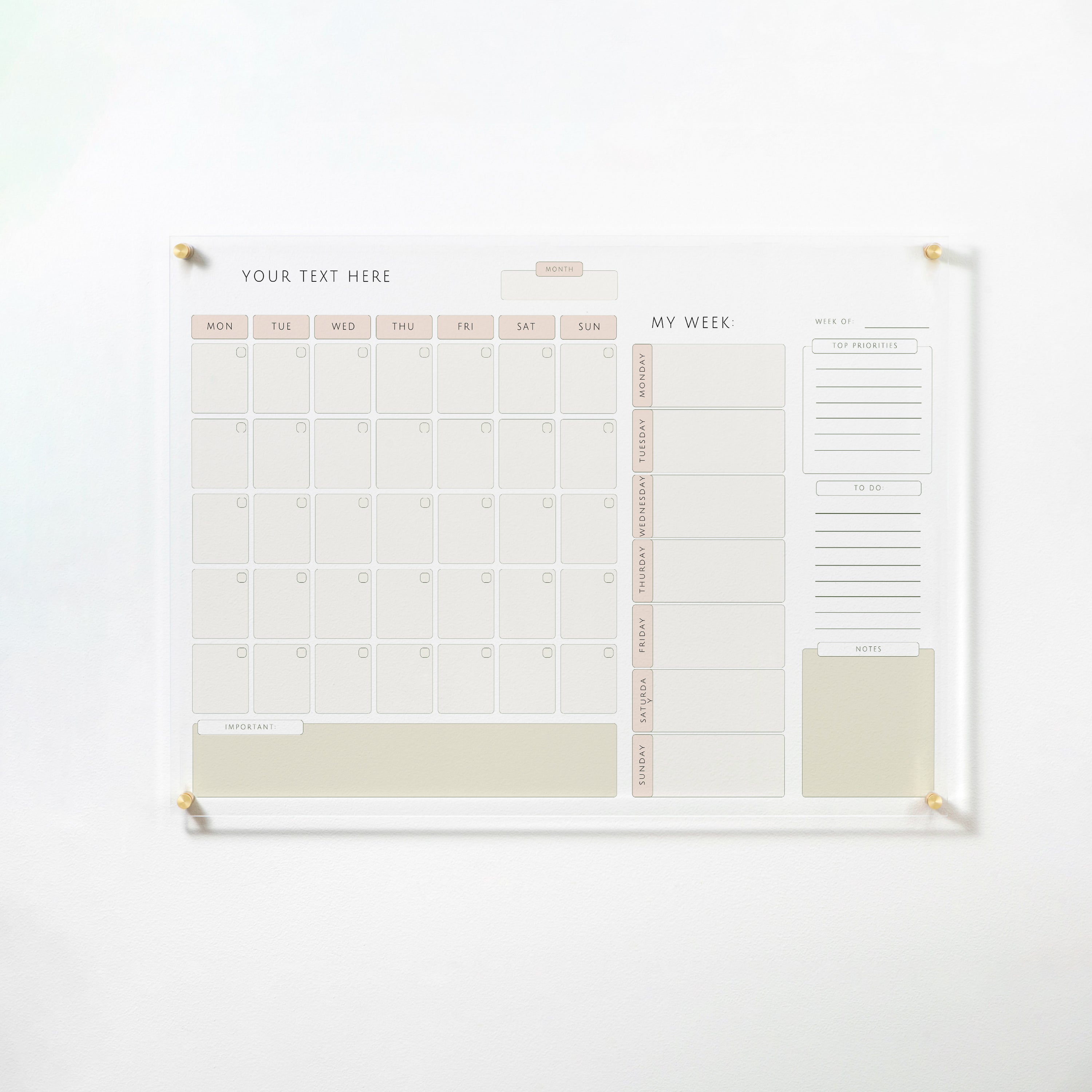 The "Custom Weekly Monthly Planner - Neutral" dry erase acrylic board mounted on a wall with gold pins. It features a monthly calendar grid, sections for weekly planning, top priorities, to-dos, and notes. The board's neutral tones and minimalist design offer an elegant and functional planning tool.