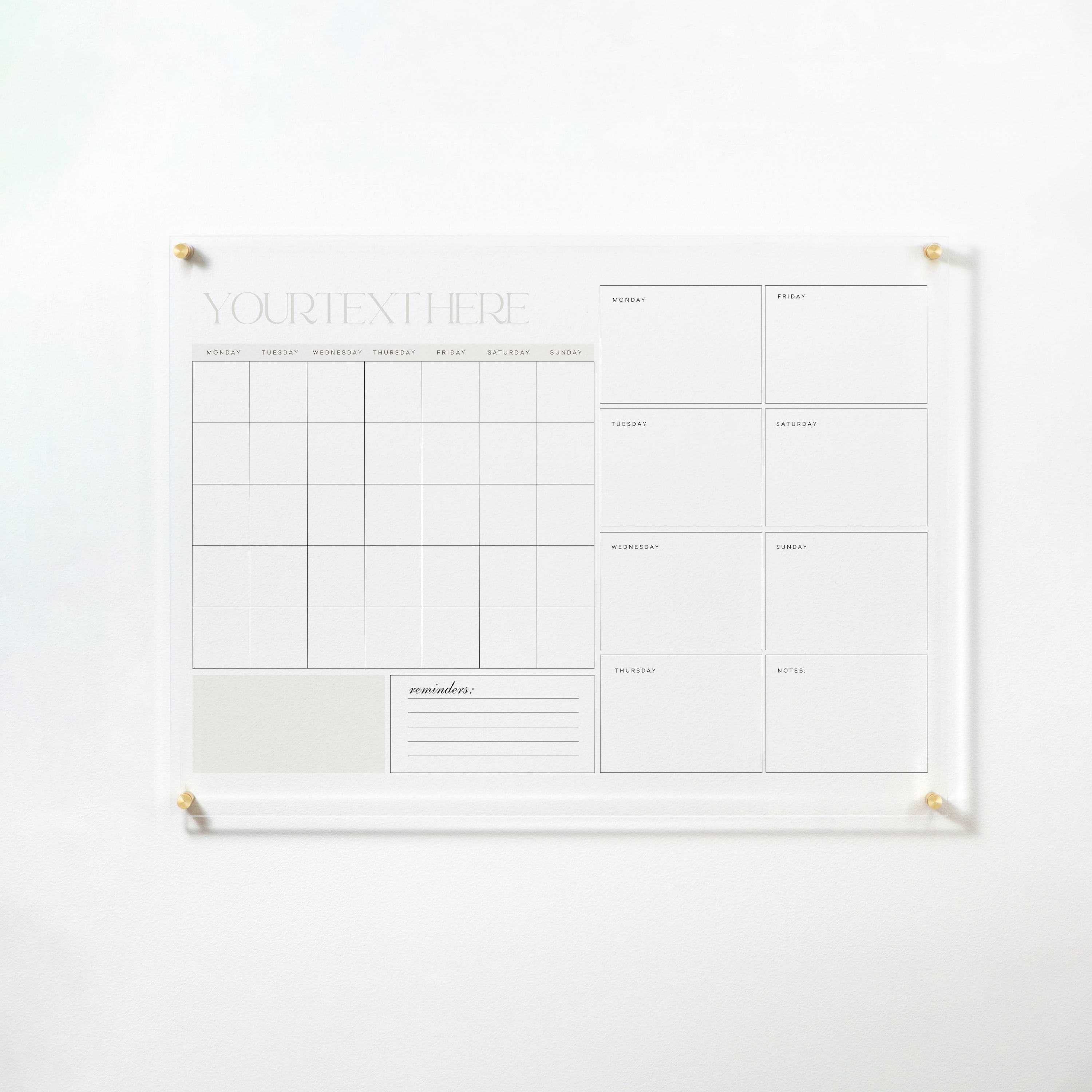 Full view of a dry erase calendar mounted on a white wall, showcasing a monthly grid and weekly boxes with space for reminders and notes.