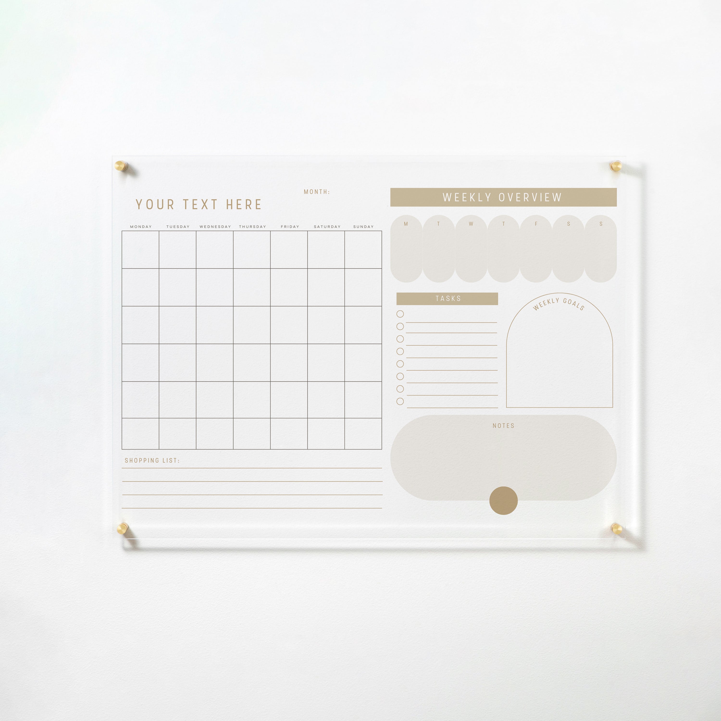 The "Custom Weekly Monthly Calendar - Whimsy" dry erase acrylic board mounted on a white wall with gold pins. It features a monthly calendar grid, "Weekly Overview," "Tasks," "Weekly Goals," and "Notes" sections in soft beige tones for a cohesive and stylish planning tool.