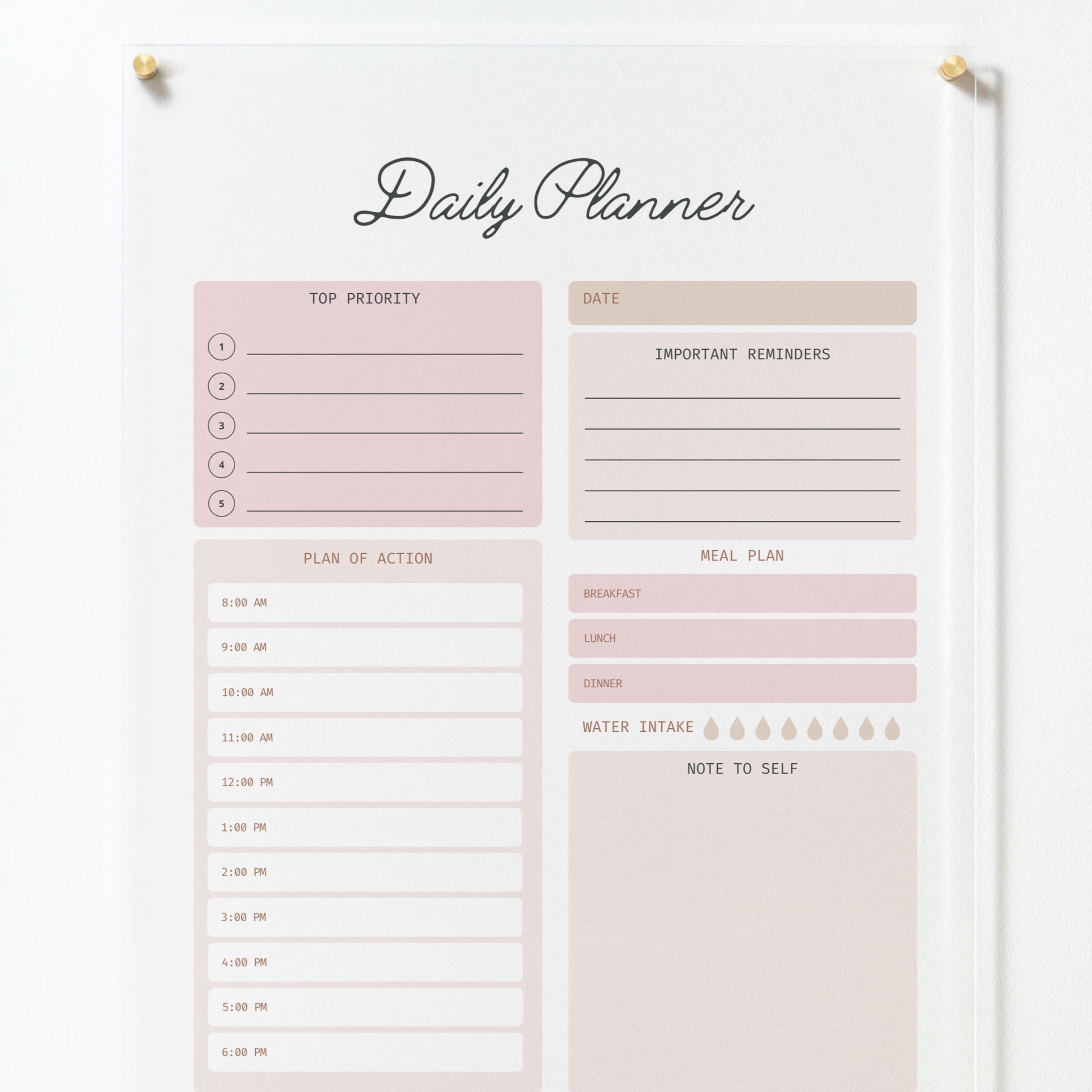 The full view of the same acrylic board, mounted on a white wall with gold pins. The board includes sections for top priority, date, important reminders, plan of action, meal plan, water intake, and note to self, all in a soft pink and beige color scheme, adding a touch of elegance to any space.