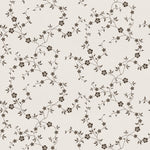This image is a straightforward depiction of the "Mini Charming Floral Wallpaper - Deep Brown", focusing on the pattern. It shows the continuous small-scale print of brown florals and green foliage on a light neutral base, which conveys a sense of vintage elegance suitable for various interior styles.