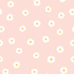 A close-up view of the Daisy Daze Wallpaper, showcasing its charming pattern of white daisies with yellow centers scattered across a light peach background. This vibrant and cheerful wallpaper pattern brings a playful yet subtle aesthetic to any room, ideal for spaces needing a touch of whimsy.