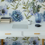 A serene workspace enhanced by Indigo Floral Wallpaper, featuring bold blue blossoms that add a touch of nature-inspired beauty. The clean white desk and modern chair create a refreshing workspace ambiance.