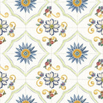 A close-up of the Spanish Tile Wallpaper showing the intricate pattern details, including blue and yellow sunburst motifs surrounded by smaller floral designs and green accents, resembling traditional hand-painted tiles.