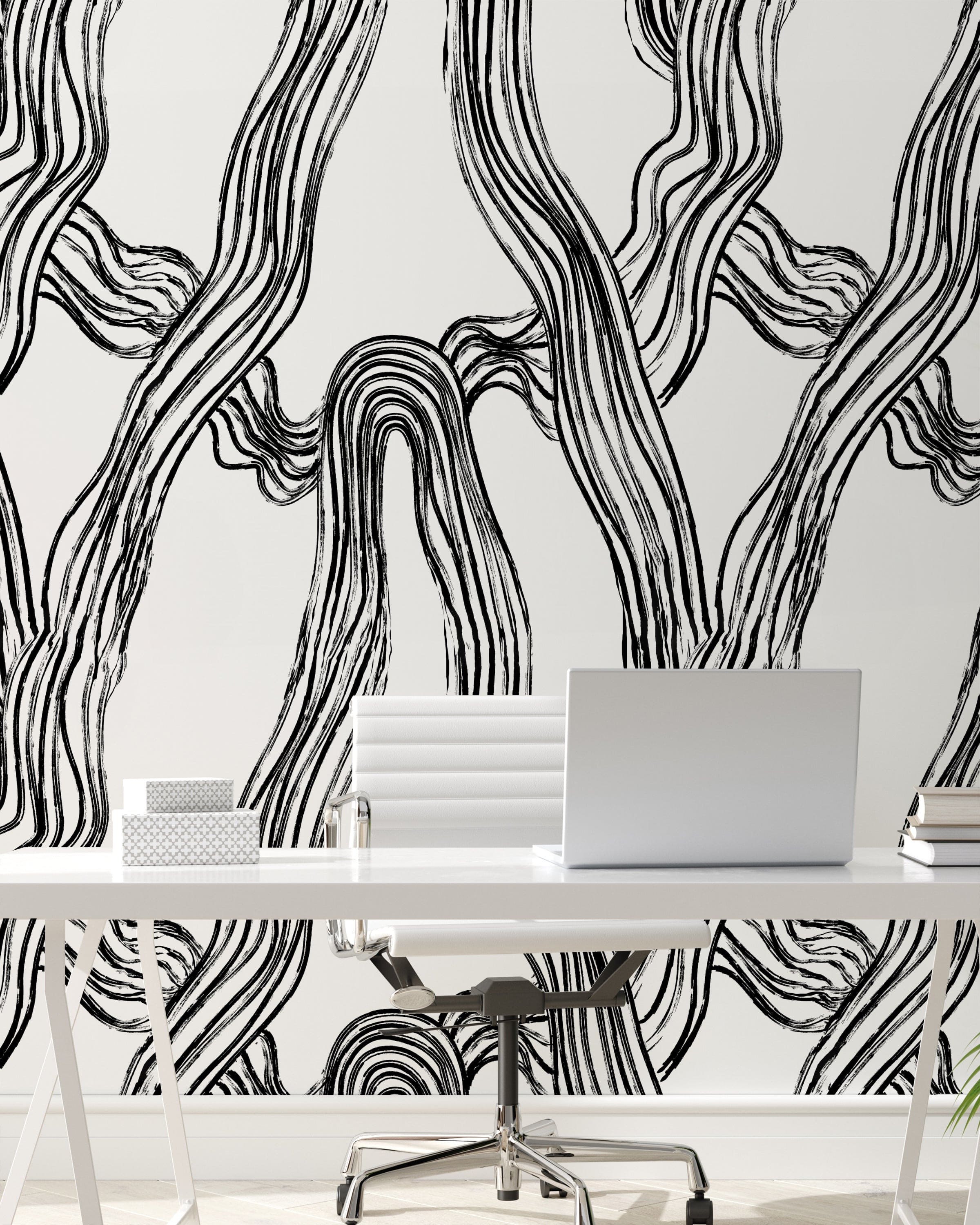 Modern workspace featuring a sleek white desk with a laptop, surrounded by walls covered in an abstract black and white flowing lines wallpaper, giving a dynamic and artistic atmosphere to the room.