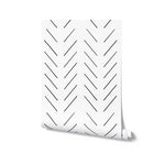 A roll of 'Minimal Line Wallpaper' presented against a white backdrop, displaying the wallpaper's contemporary design of black diagonal lines on a white surface, perfect for a minimalist decor theme.