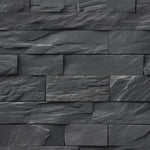 A close-up view of Black Brick Wallpaper showcasing its textured, stacked stone design in dark gray. The wallpaper's realistic stone appearance adds a bold and contemporary touch to any room.