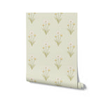 Roll of floral wallpaper with white flowers on a light green background