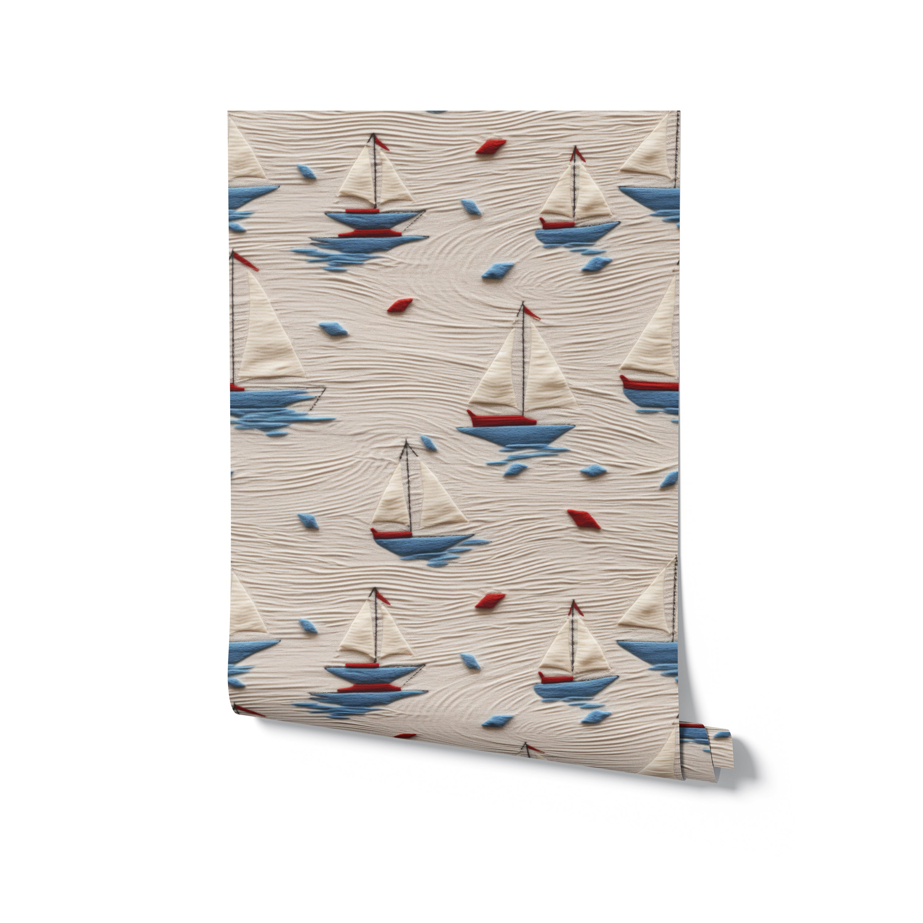 A roll of Windward Sail Wallpaper displaying a pattern of elegant sailboats with red and blue accents on a beige, sandy background, ideal for adding a nautical charm to any space, from bedrooms to play areas.
