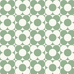 A vibrant and playful pattern of the Vintage Groovy Wallpaper in green, showcasing a repetitive geometric design with large white and green circles on a pale green background. The pattern evokes a fun and retro vibe, perfect for adding a pop of color and personality to any room
