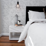 Cozy bedroom corner with Dainty Floral Line Wallpaper.