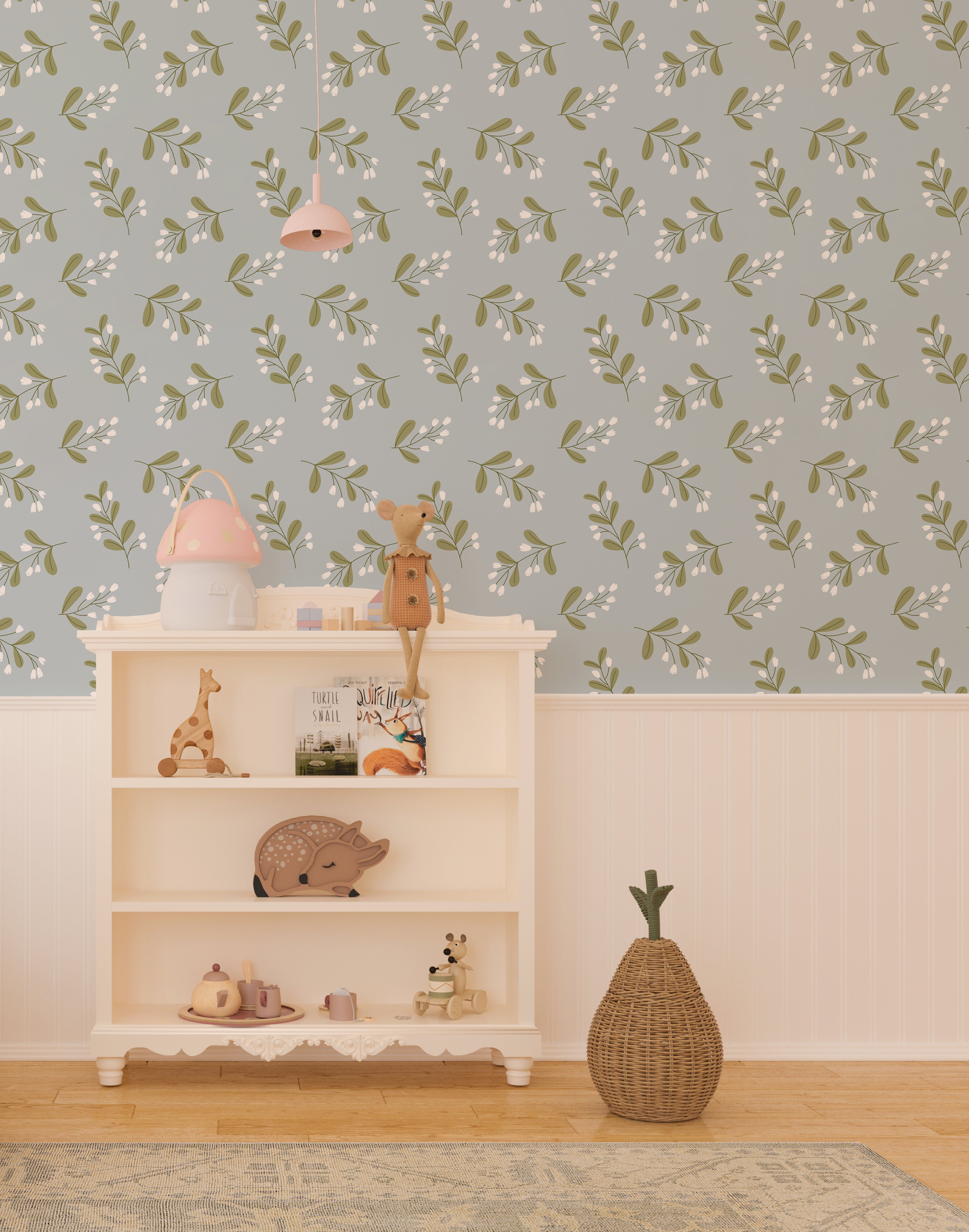 Interior view of a children's playroom with Simple Floral Wallpaper - 25" on the feature wall. The wallpaper features a delicate pattern of small white flowers and green leaves on a soft blue background, creating a whimsical and inviting atmosphere.