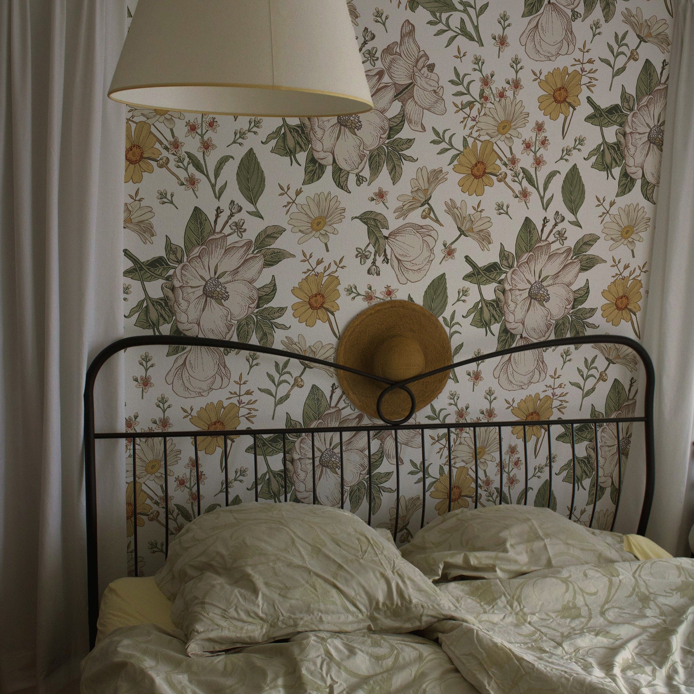 a bedroom scene where the "Floral Wallpaper - Sunny II" adds a bright and cheerful background. The playful yet elegant pattern brings a sense of joy and serenity to the bedroom, pairing beautifully with the simple bedding and natural textures.