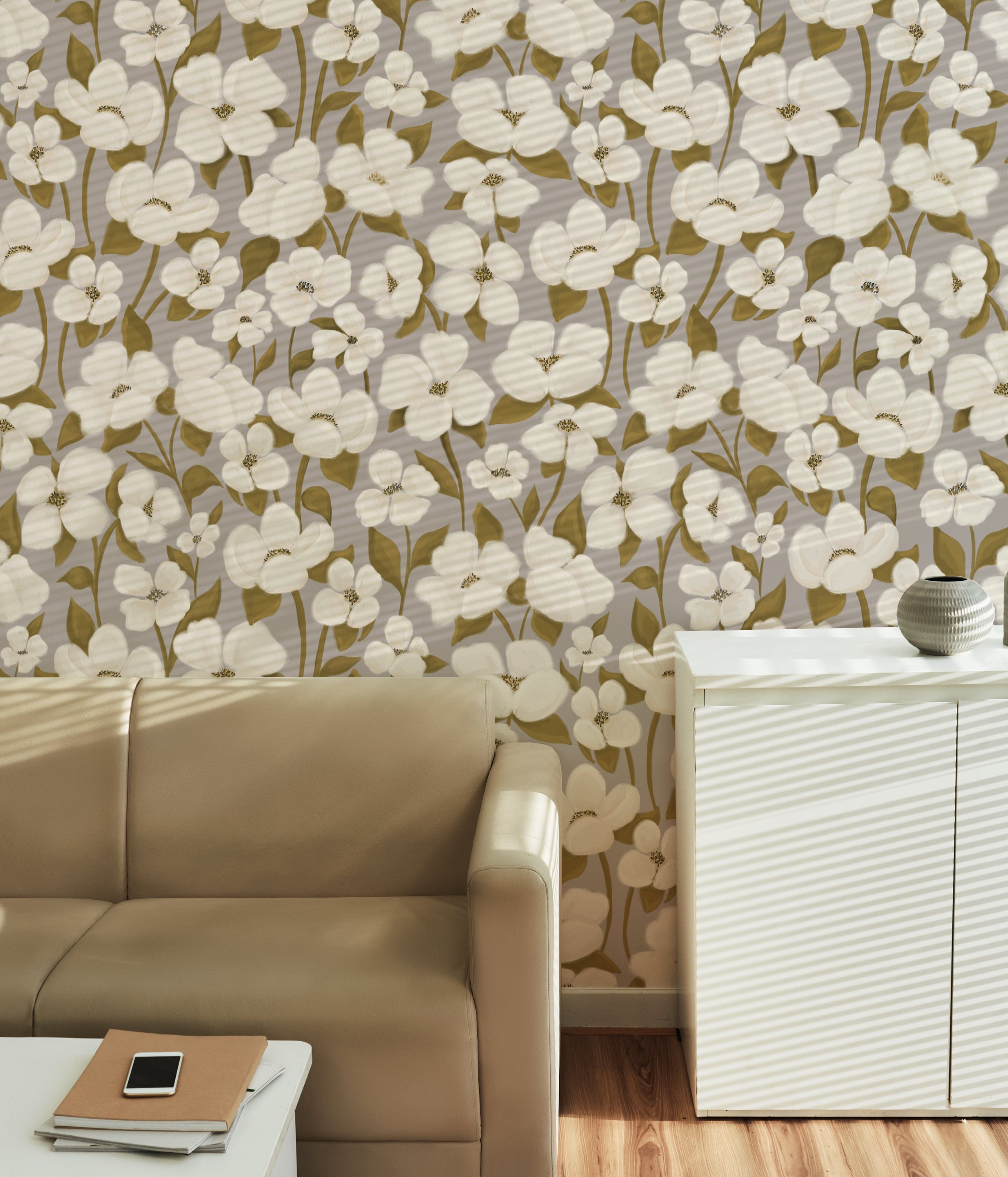 Living room setup with White Fleur Wallpaper - 50" as a backdrop. The wallpaper features a charming floral pattern with white blossoms and green foliage, adding a touch of elegance and warmth to the modern decor.