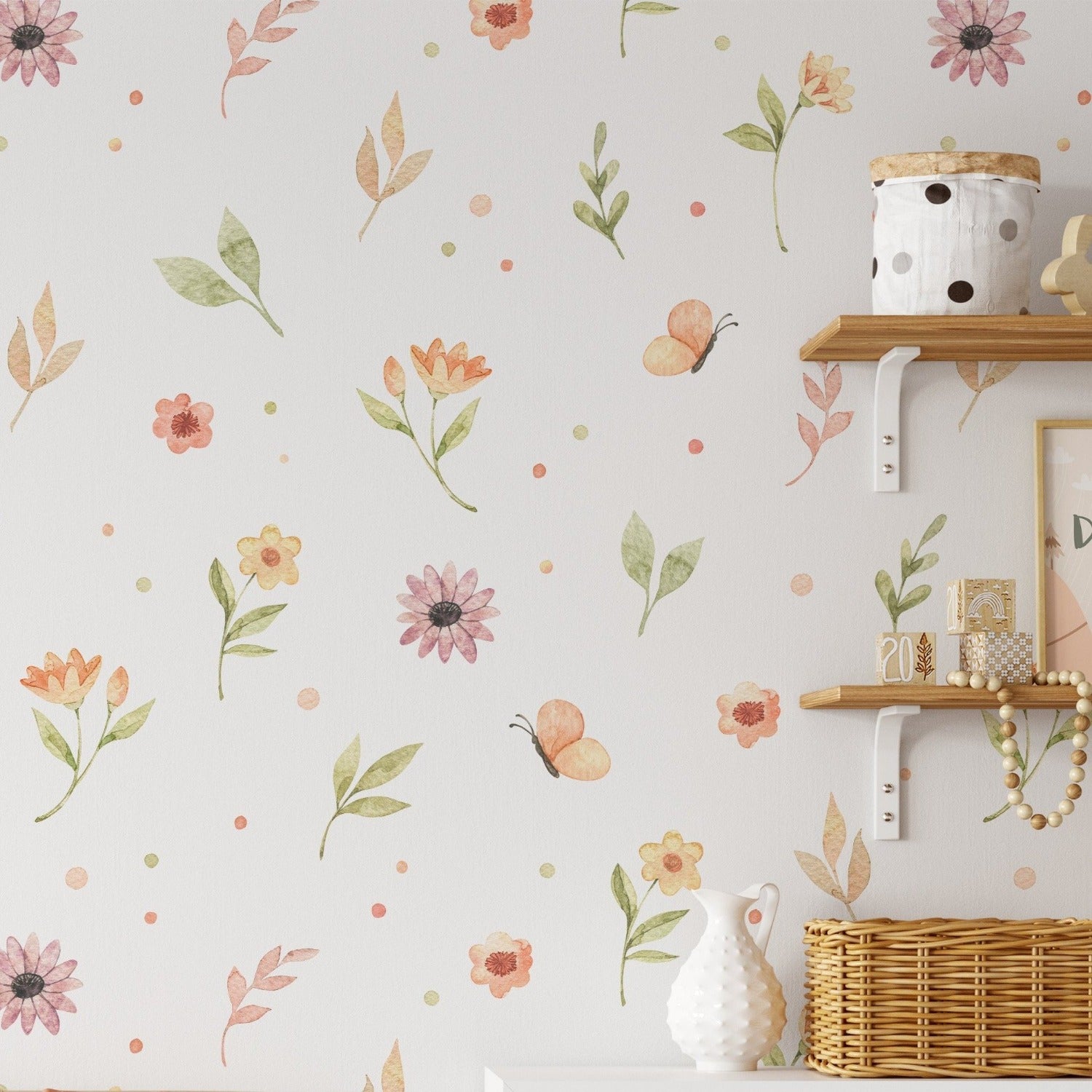 The 'Butterfly and Flower Wallpaper' is featured in a well-decorated room, providing a cheerful backdrop to a wooden shelf adorned with various decorative items. The wallpaper's pattern of pastel-colored botanicals and butterflies contributes to the room's bright and airy feel.